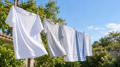 Roupas e toalhas penduradas em um varal externo sob uma brisa leve
